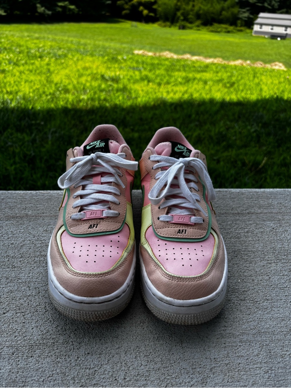 Nike Women’s Low-Top Sneakers in Pastel Pink with Mint Trim